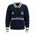 navy blue knit sweater with a striped polo collar and the text "about:blank"